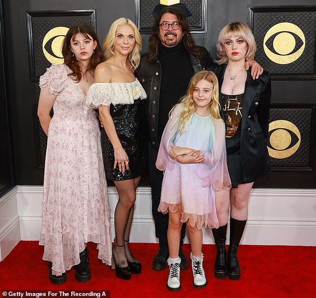 Dave tied the knot with Jordyn in 2003 and the couple share three children: Violet, 18, Harper, 15, and Ophelia, 10; Seen above in February 2023 in LA