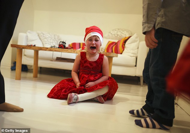 Parents reported several good and bad behaviors from their children in the run-up to Christmas Day, including sharing, helping and throwing tantrums (file photo)