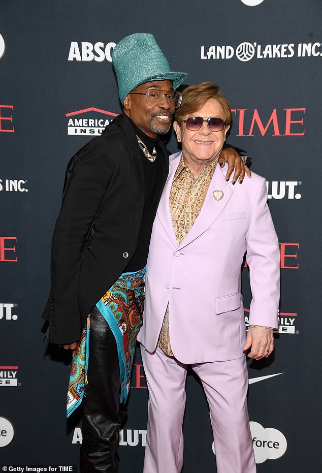 In a lengthy post on Instagram, Elton shared: 'Over the summer I dealt with a serious eye infection which has unfortunately left me with limited vision in one eye' (pictured with Billy Porter, December 11, 2024)