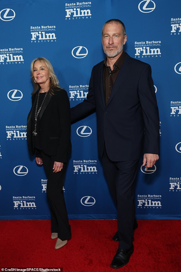 While walking the red carpet at The Ritz-Carlton Bacara prior to the ceremony for the annual Kirk Douglas Award for Excellence in Film, Bo smiled next to John