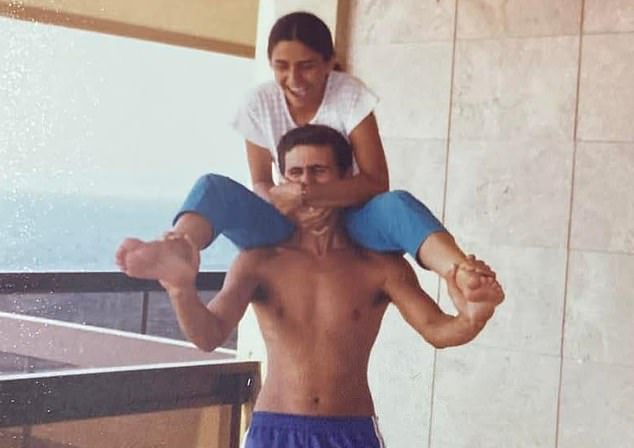 In another photo, he appears to be sitting on a balcony overlooking the sea and teasing a girl sitting on his shoulders