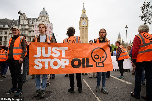 There is no suggestion that if a meeting did take place, the climate protesters were aware they were speaking to Russian spies (Photo: JSO protesters block traffic as they take part in a slow procession around Parliament Square)