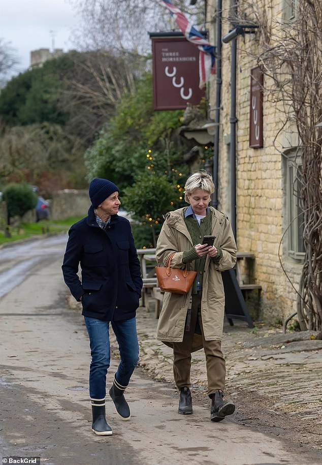 The couple take a walk past the Three Horseshoes pub in the Cotswolds