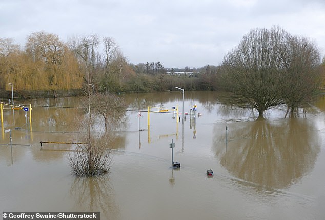 Ellen DeGeneres' multi-million pound farm in Costswolds was hit by flooding - just days after the TV star moved in. Pictured: Parts of Wallingford in Oxfordshire are underwater