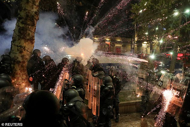 The intense protests were sparked by the government's decision to suspend negotiations on the country's accession to the European Union. Travis says he was walking home from a bar when he was jumped by police