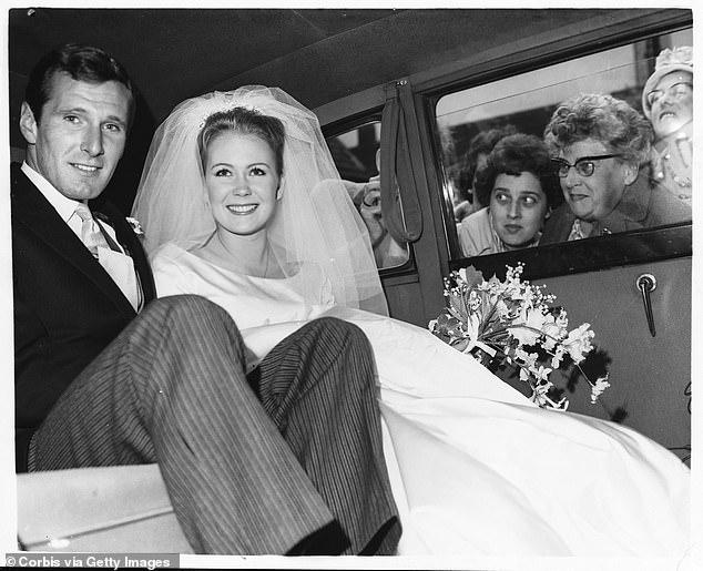 Mills and actor Russell Alquist drive away after their wedding, England, 1961