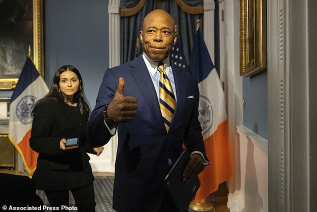 New York Mayor Eric Adams gestures as he leaves a press conference at City Hall after meeting with new President Donald Trump. "border czar" Tom Homan