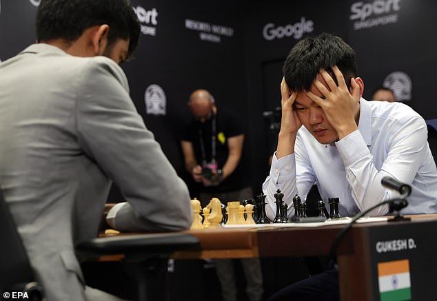 Ding Liren held his head in his hands as he realized that he had surrendered the crown in one motion