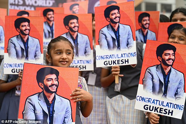 Indian students congratulate the world's youngest chess champion Gukesh Dommaraju on December 13, 2024 in Chennai