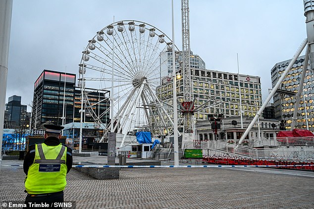 Police at the cordoned off Star Flyer attraction in Centenary Square, Birmingham, on Friday morning