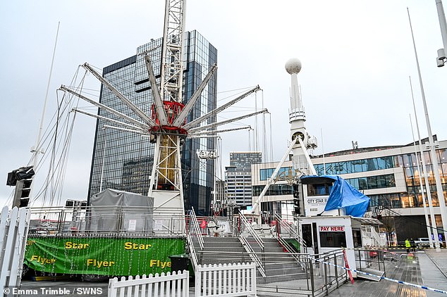 Two people have been taken to hospital after a 55m fairground ride 'failed and crashed' in Birmingham city center (pictured at the fairground on Friday morning)