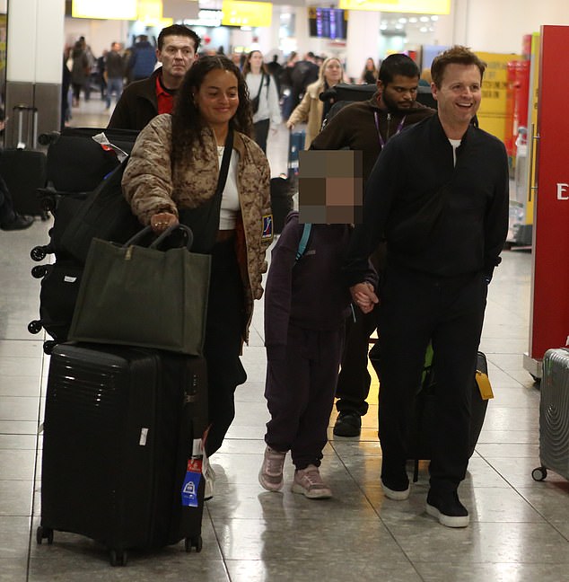 Declan Donnelly returned to a warm welcome - and freezing weather - before heading through Terminal 2 with their luggage after a 23-hour flight from Brisbane (December photo)