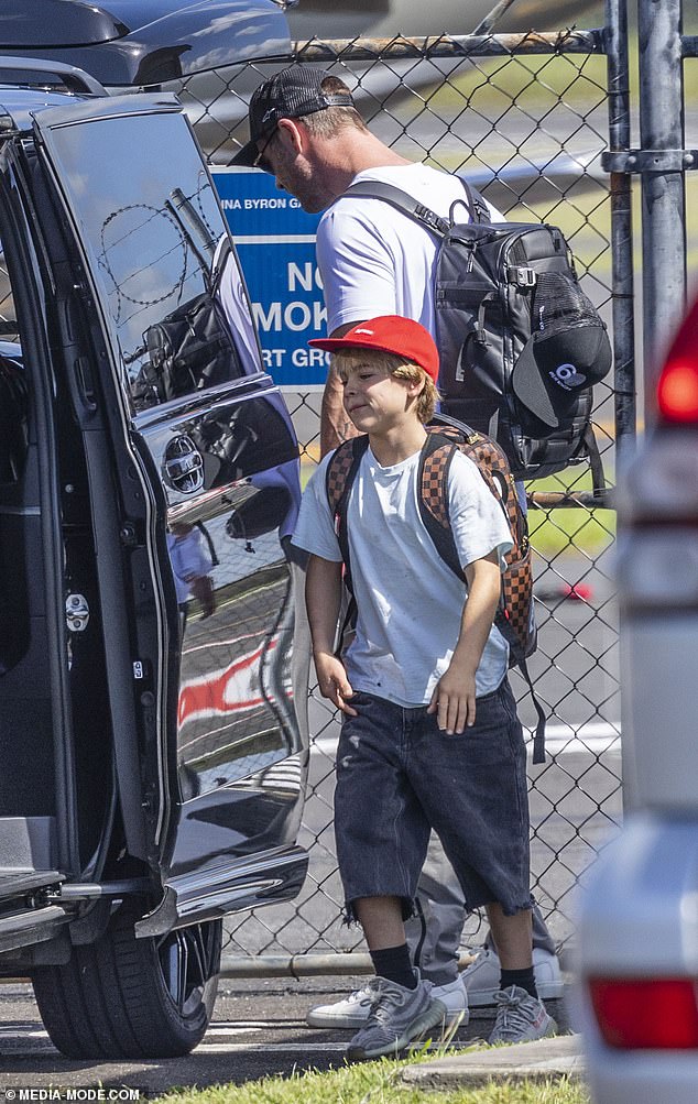 On Thursday, Chris was then photographed landing at Ballina airport with his son Tristan, 10, as they prepared to reunite with Elsa.