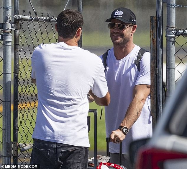 The Hollywood icon looked travel-ready in a white T-shirt and baggy gray trousers, which he teamed with a pair of smart white trainers