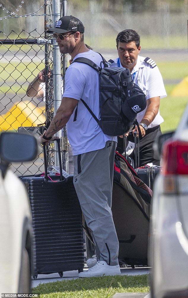 Carrying his essentials in a black backpack, he was every bit the doting father as he stepped out next to his son