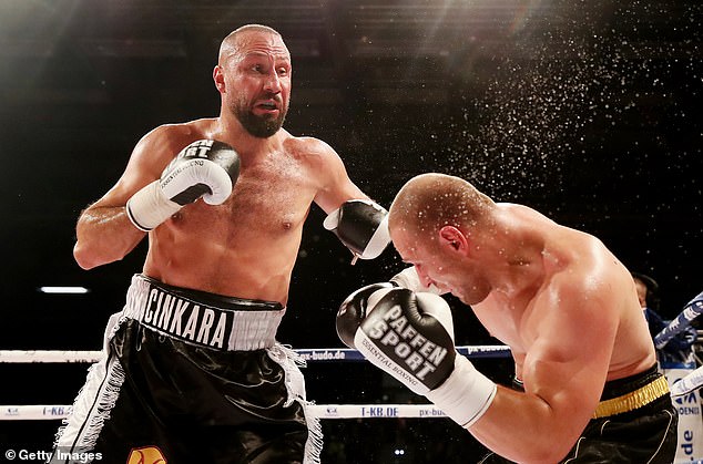 German star Huseyin Cinkara (left) has broken his ankle and has been ruled out of the fight