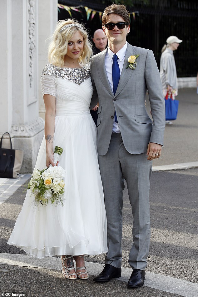 She said on Alan Carr's podcast in 2021: 'I think booking at the local Travelodge would make us feel sexy for me and my husband at the moment' (pictured at their 2014 wedding)