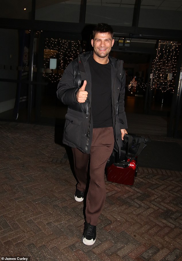 Tasha's professional dance partner Aljaž Škorjanec gave a thumbs up as he left the hotel wearing brown trousers, a black sweater and an oversized jacket