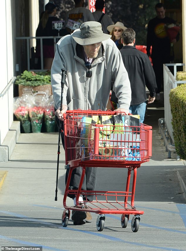 After returning his cart, he was pictured walking back to the car with the aid of a cane