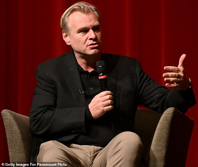 Nolan is pictured Tuesday interviewing fellow iconic filmmaker Ridley Scott on stage in Los Angeles in support of his film Gladiator II