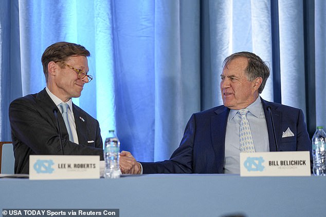 Belichick shakes hands with University of North Carolina Chancellor Lee Roberts