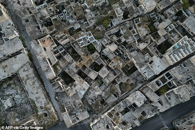 This aerial photo shows a destroyed building in Maaret al-Numan, in Syria's northwestern province of Idlib, on December 14