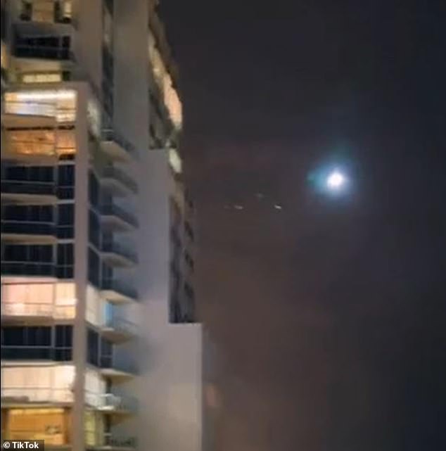 A New Jersey real estate agent shared a shocking video of a bright dot floating through the sky toward a luxury apartment building on South Beach