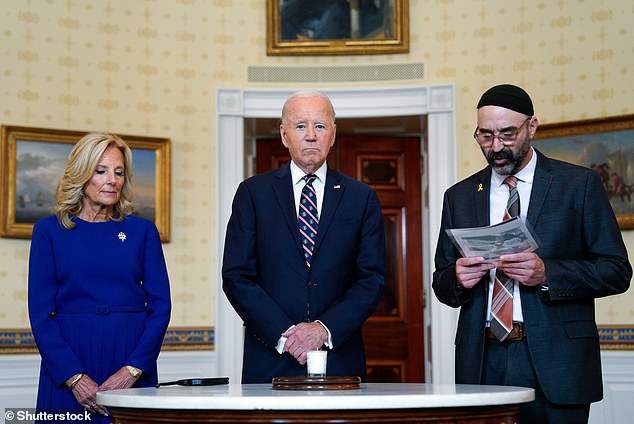 President Joe Biden bowed his head as a rabbi sang a Hebrew prayer during a somber White House ceremony marking the one-year anniversary. He left without saying a word about American citizens still being held hostage in Gaza