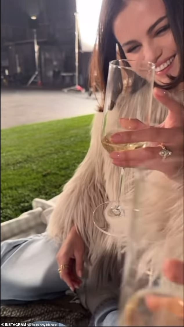 He filmed the actress at the romantic picnic as they shared glasses of champagne, just moments after he popped the big question