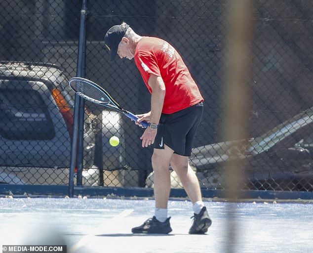 The comedian, whose radio show was axed from 2DayFM in August, looked glum as he spent the warm day with a friend in Melbourne.