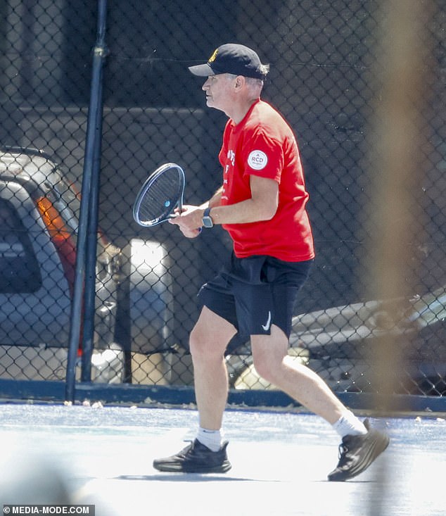 Hughesy, 54, showed off his athletic skills in a red T-shirt and black Nike gym shorts