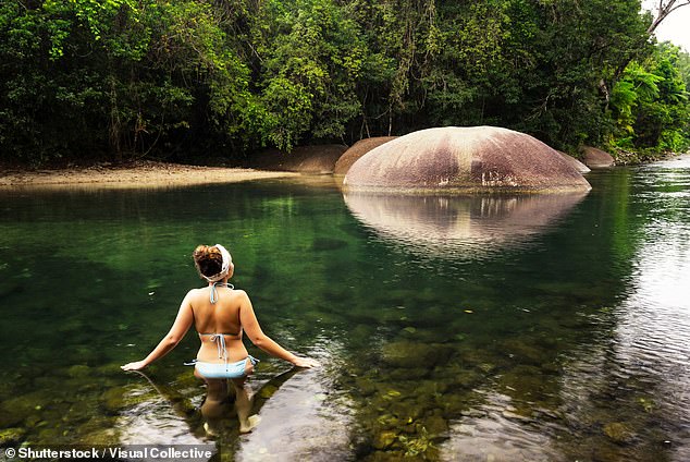 The remote waterfall is not far from the infamous Babinda Boulders (pictured)