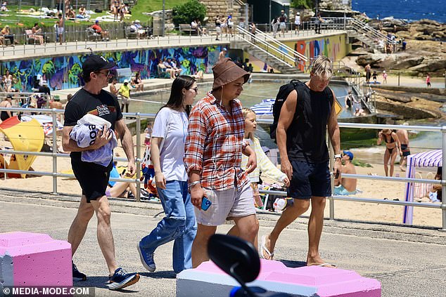 The group walked along the boardwalk and mingled with locals enjoying the sun on the hot summer day