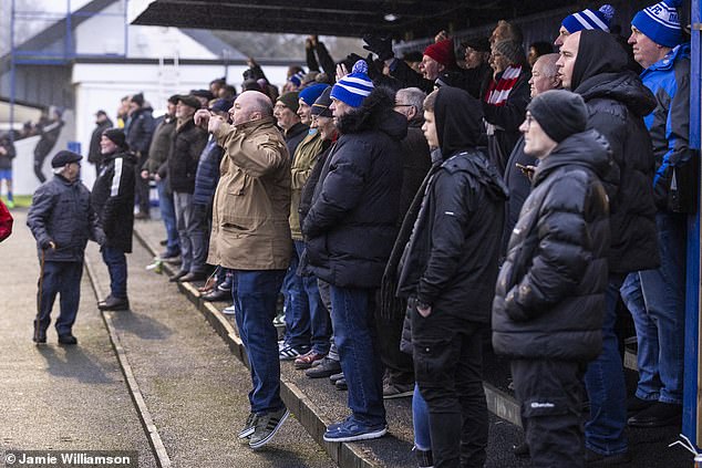 Fans shout encouragement as the teams compete in the Junior Cup