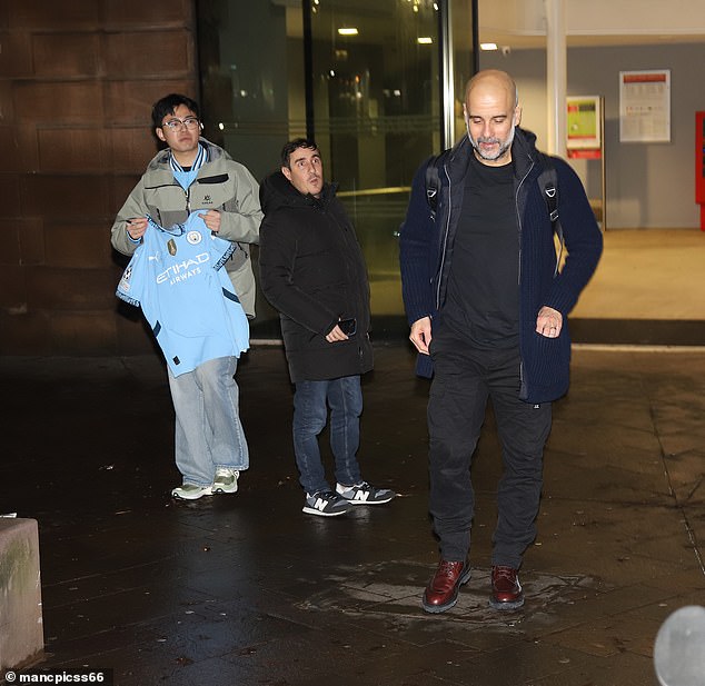 After signing the shirt for the fan, a smiling Guardiola walked towards his apartment building