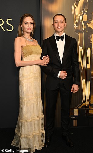 Angelina poses on the red carpet next to son Knox Jolie-Pitt, 16, on Nov. 17