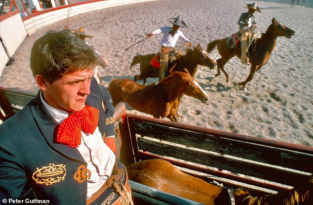 As part of San Antonio's annual Fiesta, an A Day in Old Mexico celebration is presented by the city's Charro Association, the largest and oldest of its kind this side of the Rio Grande. Elegantly robed and dressed, this seated charro ponders his dangerous upcoming Paso de la Muerte event