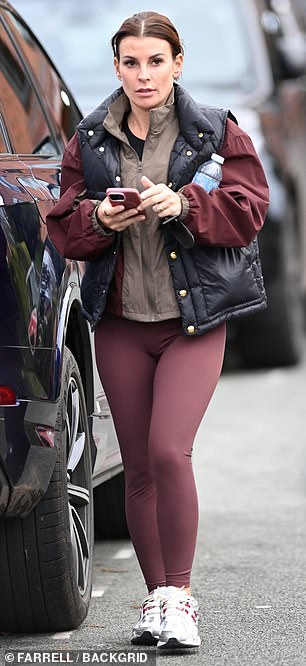 Coleen showed off her stunning physique in plum leggings and a black padded jacket