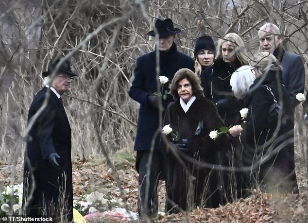 Queen Silvia and attendees carried a single white rose during the funeral of Princess Birgitta at the Royal Cemetery in Hagaparken