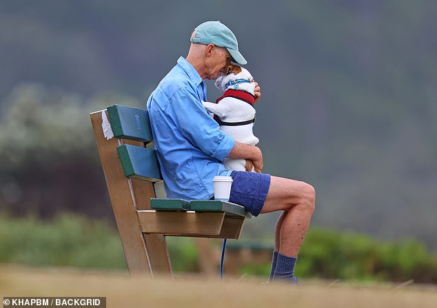 Serious cradled and cuddled his pet before heading home