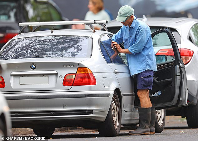 He loaded his groceries into his silver BMW before getting into his car