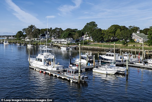 Residents of Yarmouth, a small town in the northern part of the upscale enclave of Cape Cod, had voted on whether they supported moving a small pumping station away from a cranberry swamp. (Image: Boats docked along the Bass River near South Yarmouth in Cape Cod)