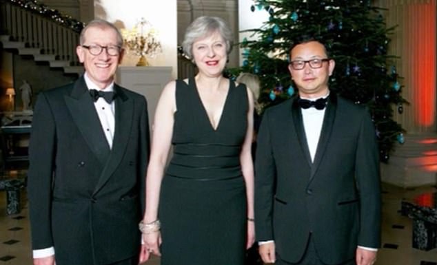 Yang Tengbo met senior Tories including Theresa May, seen here with her husband Philip