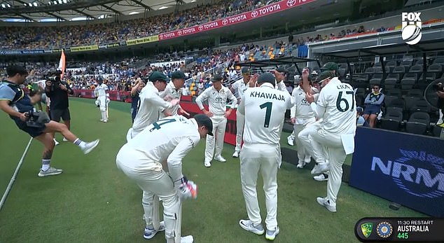 The Australian players ducked and raised their hands above their heads after a call was received