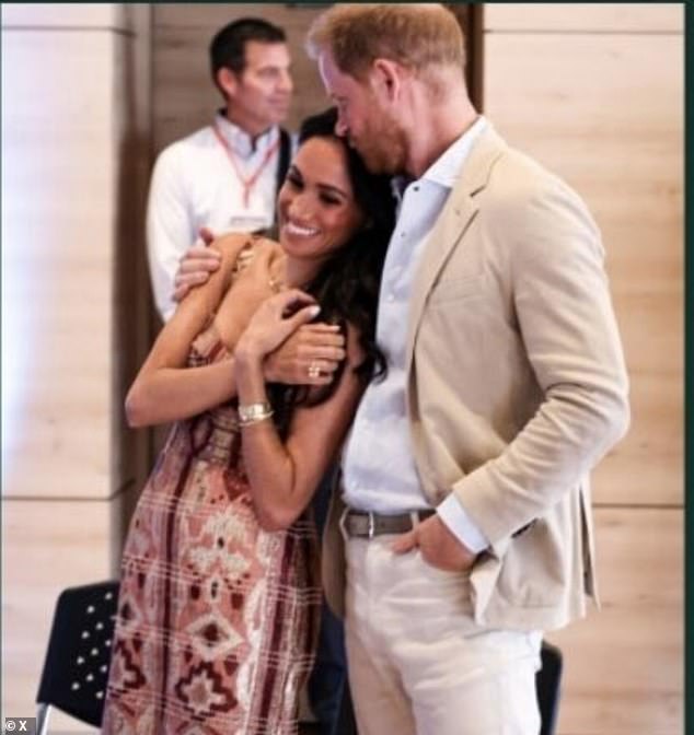 Prince Harry plants a kiss on Meghan's forehead in a photo taken during their four-day visit to Colombia in August