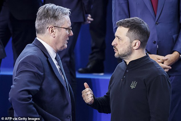 British Prime Minister Keir Starmer speaks with Ukrainian President Volodymyr Zelensky during the European Political Community summit in Budapest last month