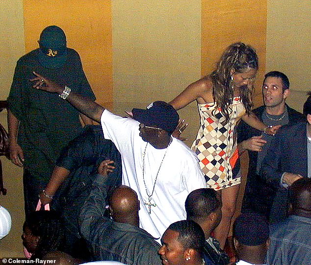 Diddy seen in a public after-party shot taken the same night with ex-girlfriend Jennifer Lopez - Jane Doe claimed the attack took place in a 'large white residence'