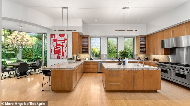 The modern kitchen is equipped with stainless steel appliances