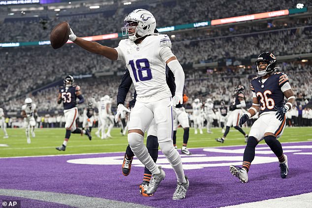 Vikings wide receiver Jefferson celebrates catching the first touchdown of the game