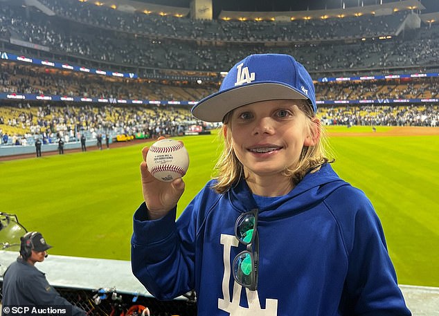 The ball ended up in the right field pavilion, where it was corralled by 10-year-old Zachary Ruderman